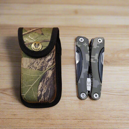 A multi-tool opened to display a knife, scissors, and other tools
