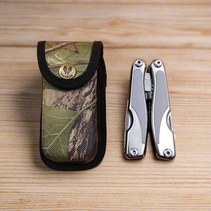 A multi-tool opened to display a knife, scissors, and other tools