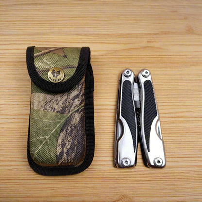 A multi-tool opened to display a knife, scissors, and other tools
