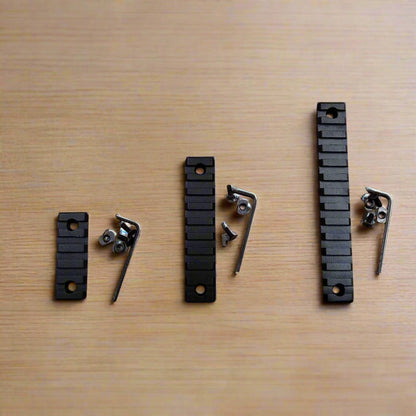 picatinny rails on a wooden surface