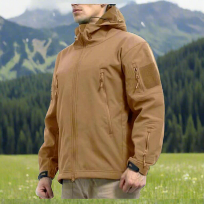 Soft Shell jacket. Jacket has multiple zippers and a hood.