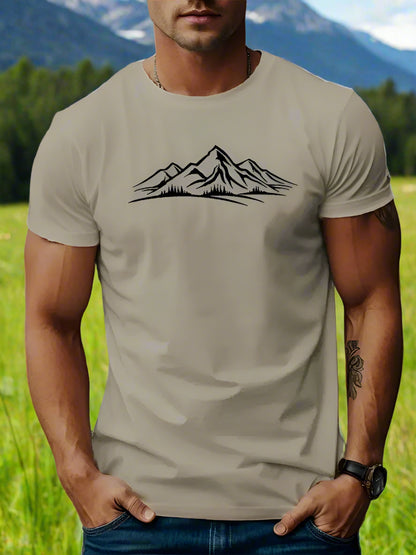 A person wearing a cream T-shirt with a white mountain design on the front.