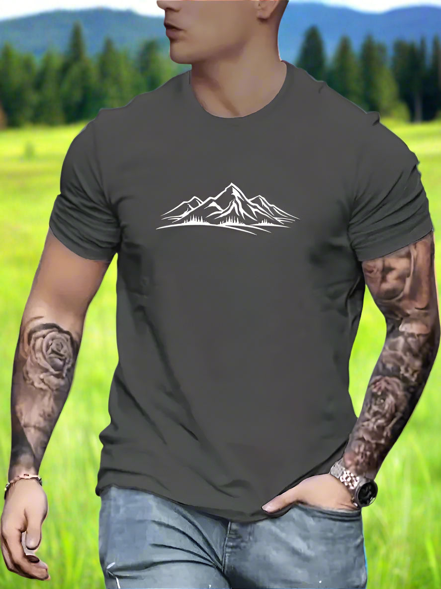 A person wearing a grey T-shirt with a white mountain design on the front.