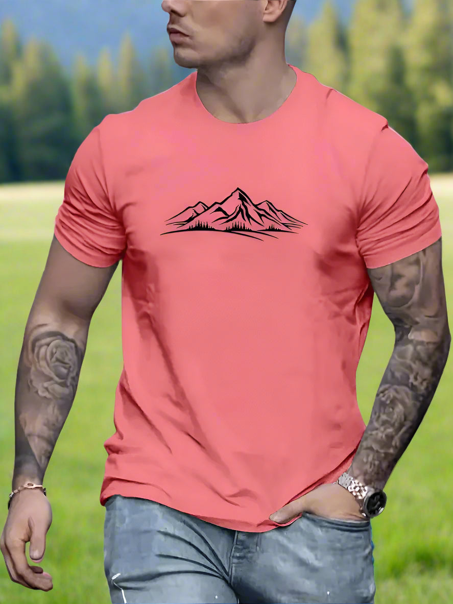 A person wearing a watermelon T-shirt with a white mountain design on the front.