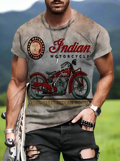 A male model wearing a gray T-shirt with a red Indian motorcycle print and the text 'Indian Motorcycle' on the chest.