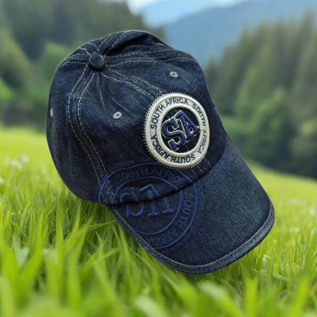 Blue denim cap with a logo on grass