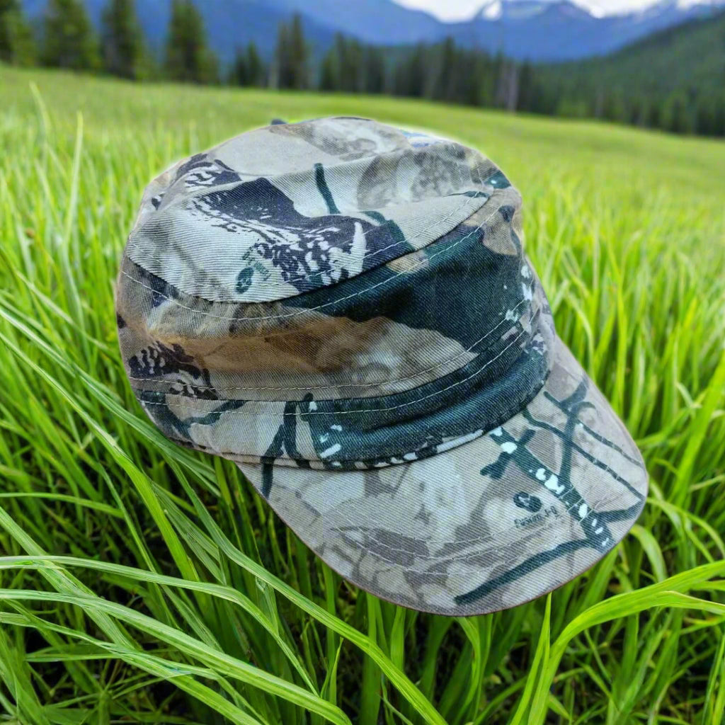 Camouflage-patterned flat top cap on a beige background