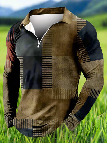 A long sleeve men's shirt with a geometric block pattern in brown and blue colors, featuring a collar and a zipper at the neck.