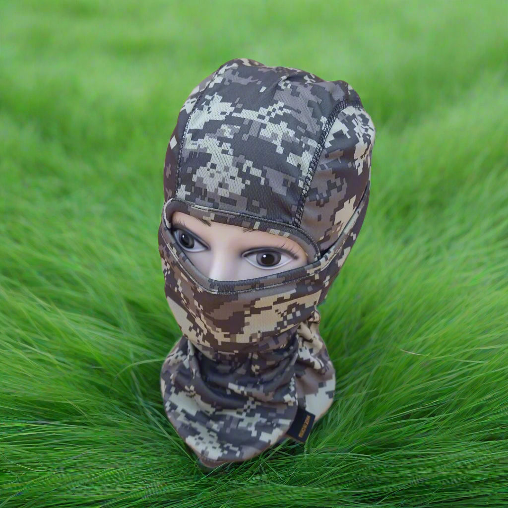 A person wearing a camouflage patterned full face mask covering.