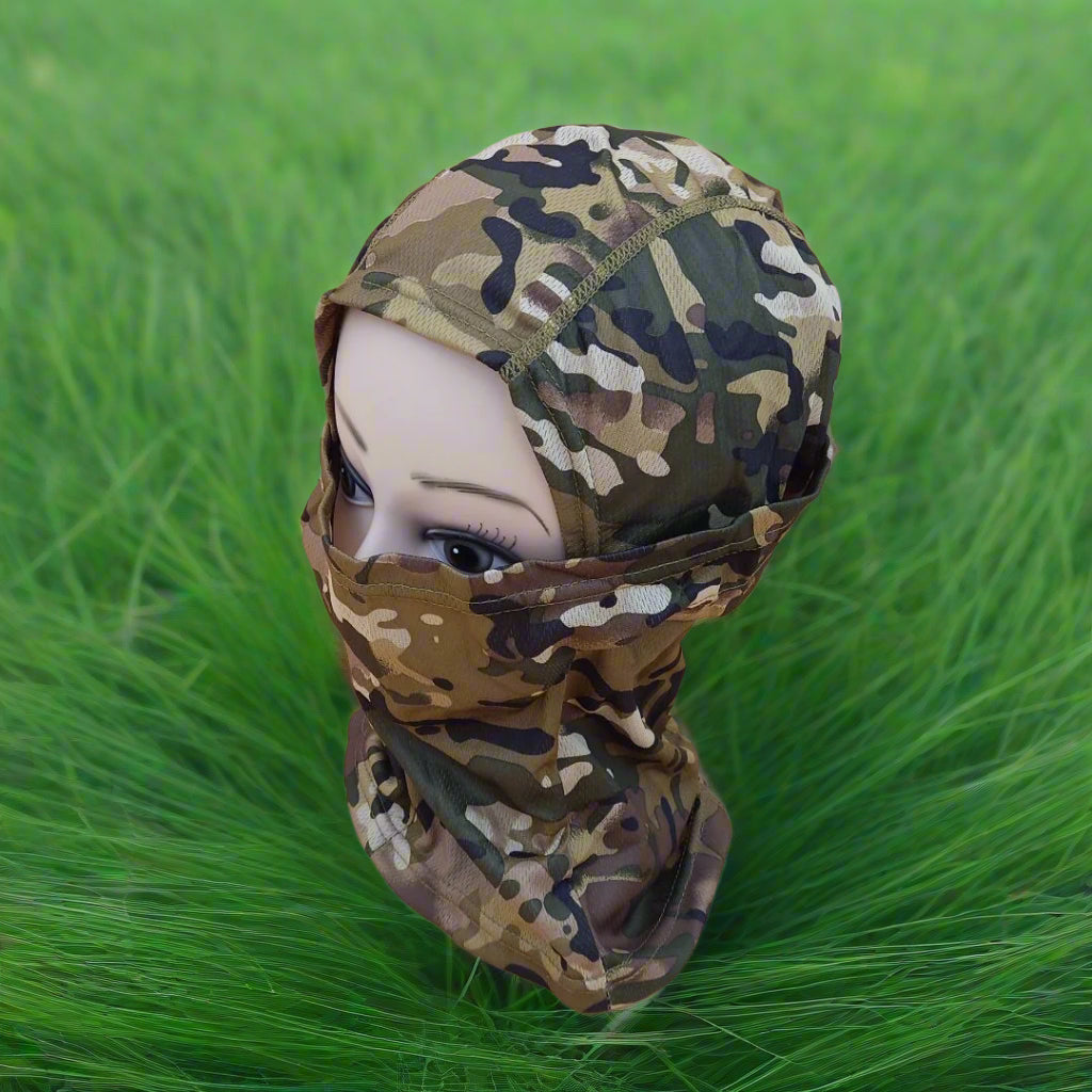 A person wearing a camouflage patterned full face mask covering.