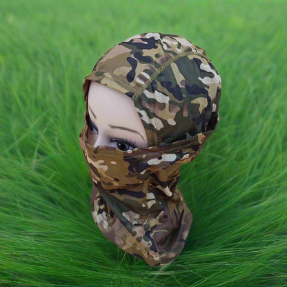 A person wearing a camouflage patterned full face mask covering.