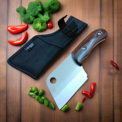 Meat cleaver with sheath on a wooden surface with vegetables