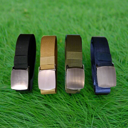 Four belts in black, khaki, green, and blue on a grass background
