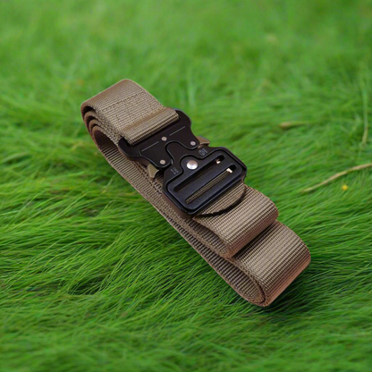 Khaki tactical belt with a black buckle on green grass