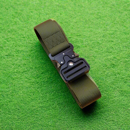 Green belt with a black buckle on grass
