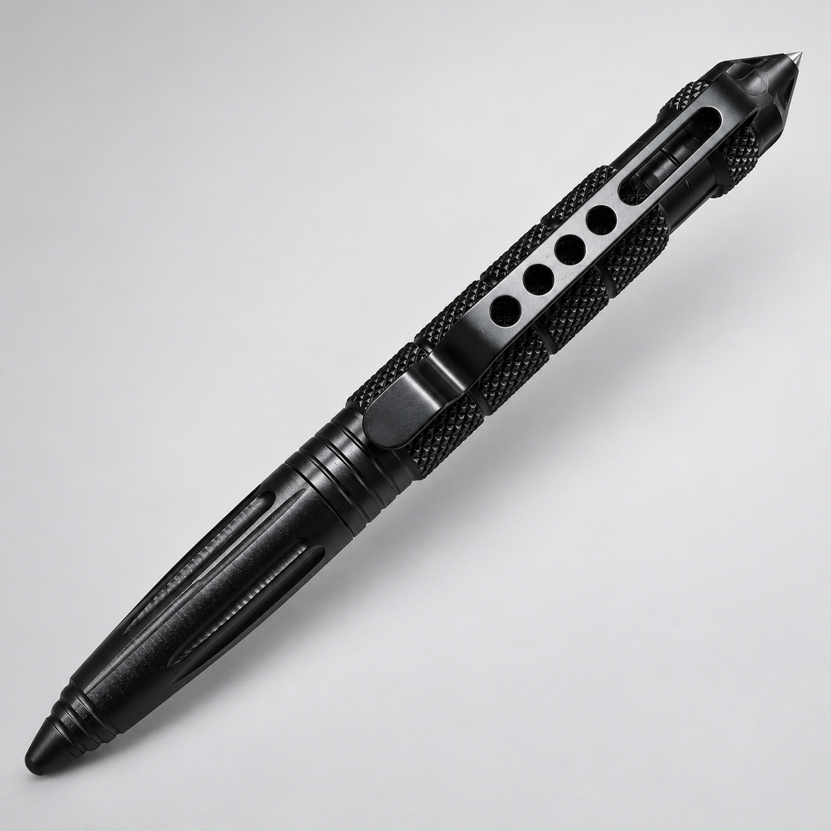 Black tactical pen showing pocket clip and textured grip