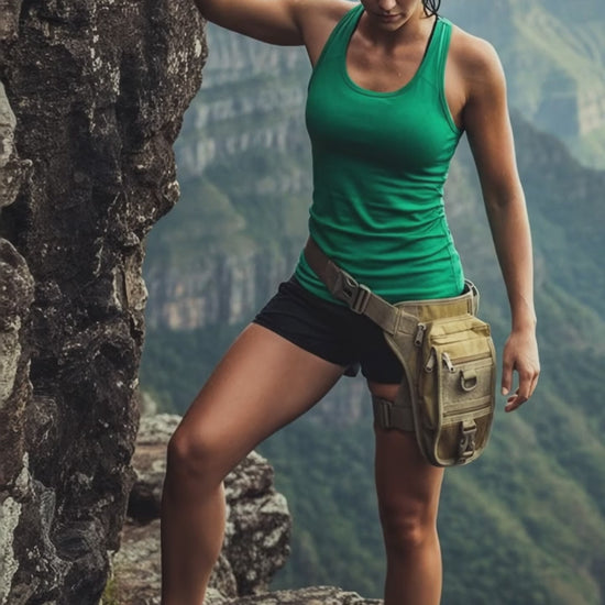 A person wearing a khaki thigh pouch with multiple compartments and a removable holster