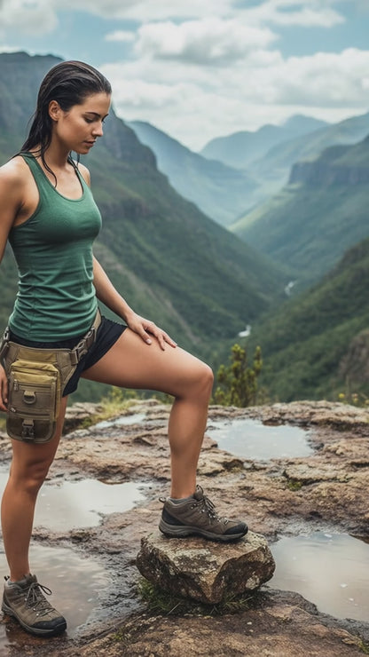 A person wearing a khaki thigh pouch with multiple compartments and a removable holster
