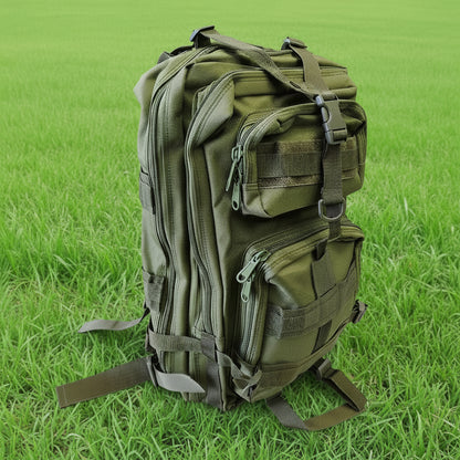 Green tactical backpack on a white surface with a wooden background