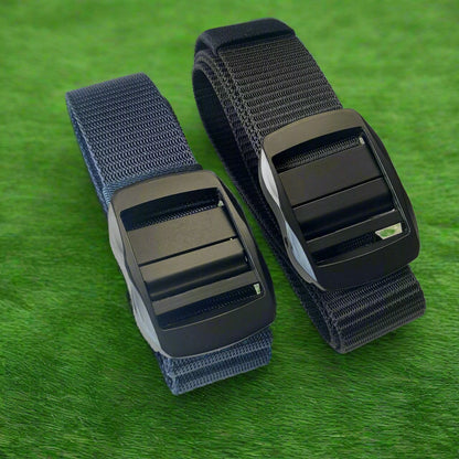 Two belts with black buckles on a textured gray background