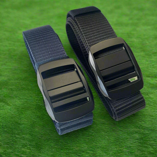 Two belts with black buckles on a textured gray background