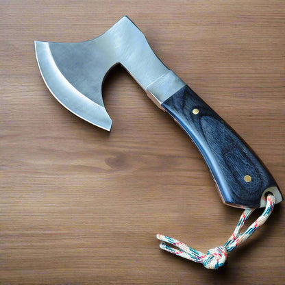 Axes with a wooden handle and metal blade on a wooden surface