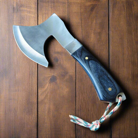 Axes with wooden handles on a wooden surface