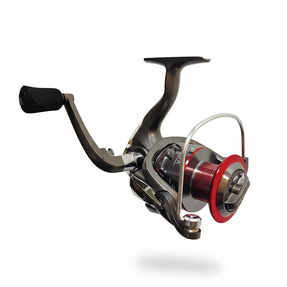 Fishing reel with red spool on a white background