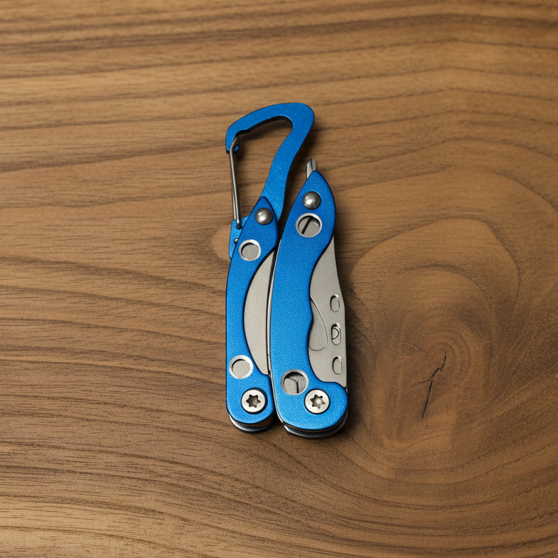 Blue multi-tool with carabiner on a gray background