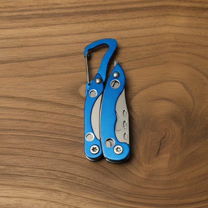 Blue multi-tool with carabiner on a gray background