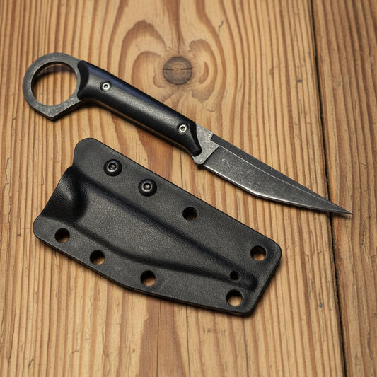 Black knife with sheath on a white background