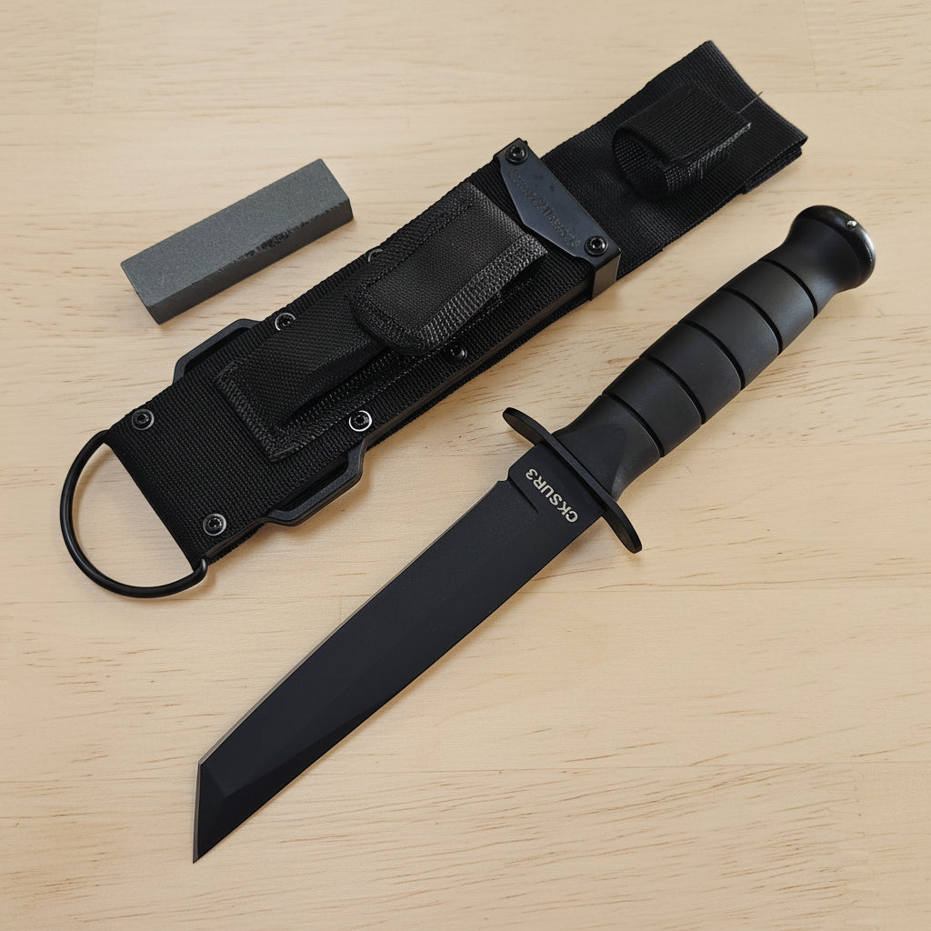 Black tactical knife with sheath on a wooden surface