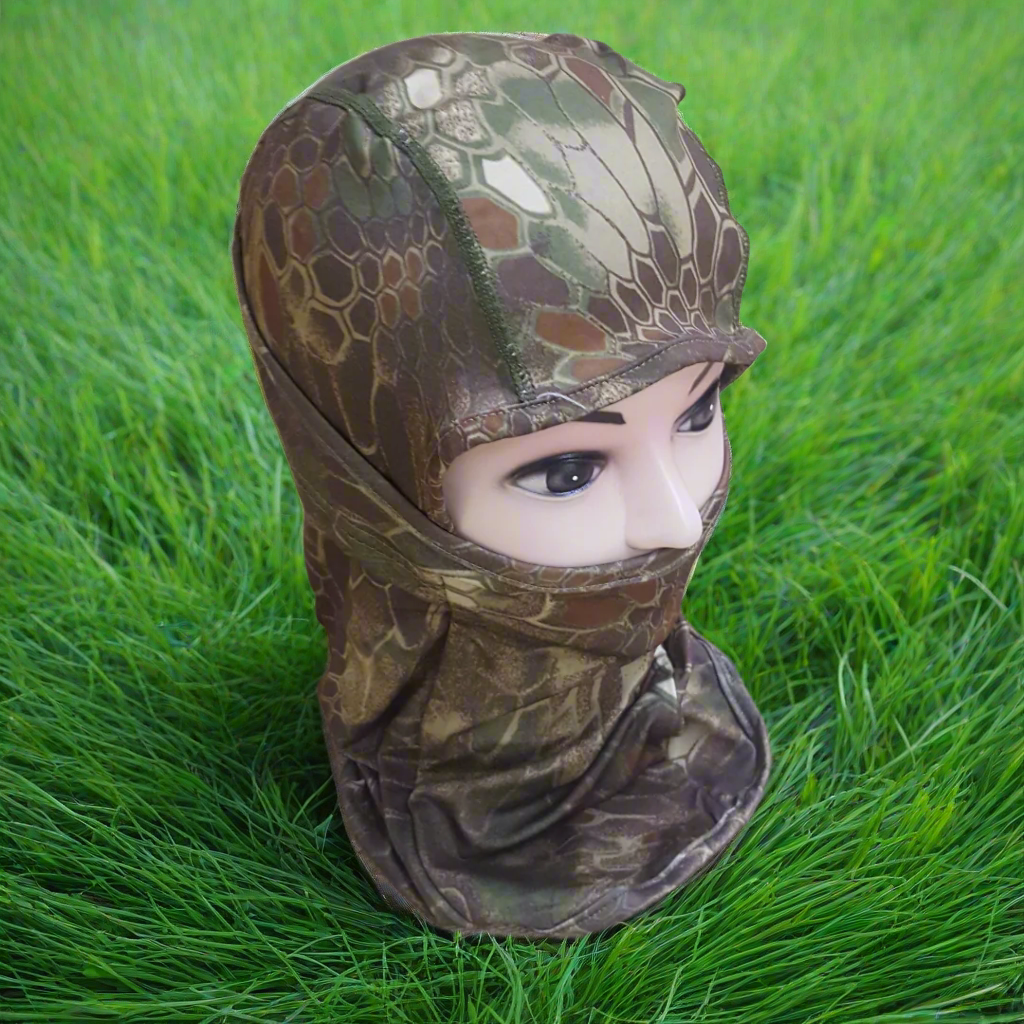 A person wearing a camouflage patterned full face mask covering.