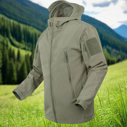 Soft Shell jacket. Jacket has multiple zippers and a hood.