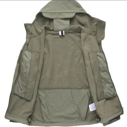Soft Shell jacket. Jacket has multiple zippers and a hood.